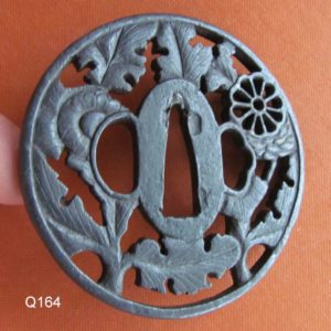 Q164. Iron Sukashi Tsuba with Paper