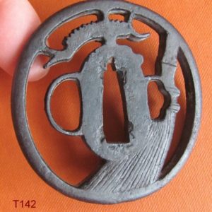 T142. Iron sukashi tsuba, Akasaka School