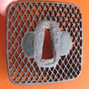 T149. Sukashi tsuba of a net