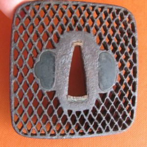 T149. Sukashi tsuba of a net