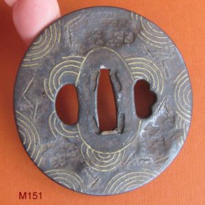 M151. Iron and brass tsuba