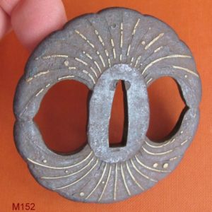 M152. Iron and brass tsuba