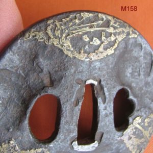 M158. Iron and brass tsuba