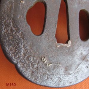 M160. Iron tsuba with gold inlay