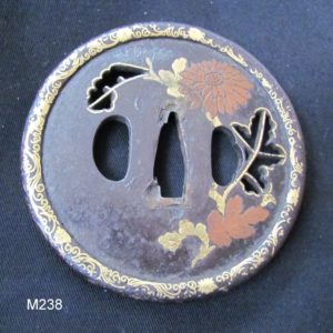 M238. Iron Sukashi Tsuba with Extensive Inlay, Kenjo