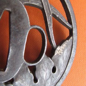 M175. Iron sukashi tsuba with gold nunome