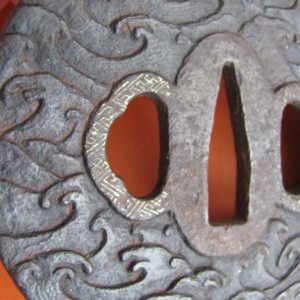 M176. Iron tsuba with gold nunome