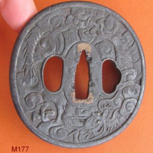 M177. Finely carved iron tsuba