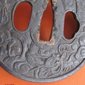 M177. Finely carved iron tsuba