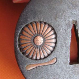 M181. Iron sukashi tsuba with filled sukashi