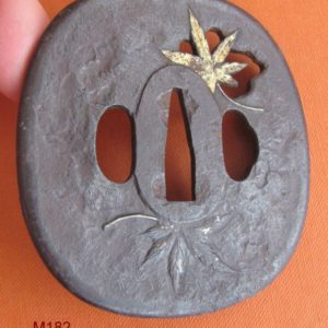 M182. Iron sukashi tsuba with gold nunome of maple leaf