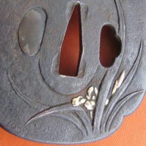 M183. Iron tsuba with gold, silver, and copper applied