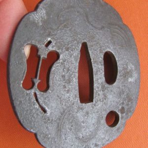 M198. Iron sukashi tsuba with soft metal inlay