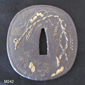 M242. Large Iron Tsuba with Unusual Inlay