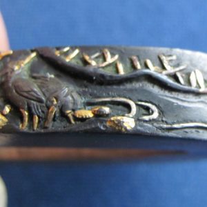 R141. Fuchi Kashira in Shakudo with Egret