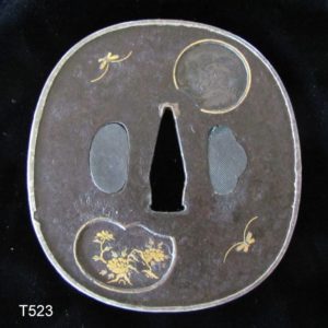 T523. Iron Tsuba with Extensive Inlay