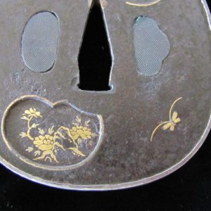 T523. Iron Tsuba with Extensive Inlay