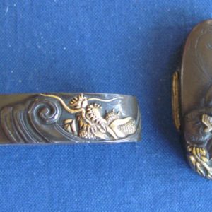 K60. Shakudo or Shibuichi Fuchi Kashira