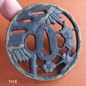 T418. Iron Sukashi Tsuba with Extensive Brass Inlay