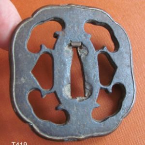 T419. Iron Sukashi Tsuba with Copper Fukurin