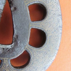 T185. Iron sukashi with brass inlay tsuba