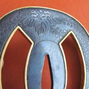 T437. Papered Higo Tsuba. Shakudo with Gold