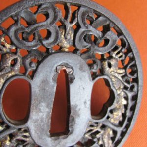 T192. Namban tsuba, Iron with gold