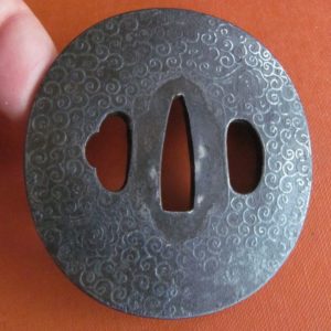 C245. Iron Tsuba with Elaborate Silver Inlay