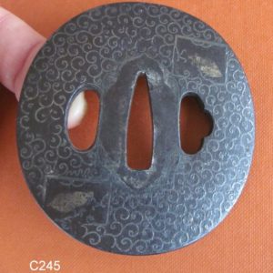 C245. Iron Tsuba with Elaborate Silver Inlay