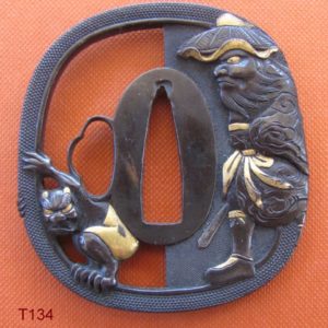 T134. Shakudo nanako sukashi tsuba