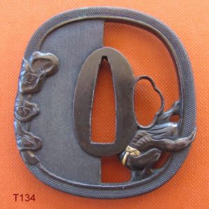 T134. Shakudo nanako sukashi tsuba