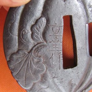 D104. Signed iron tsuba