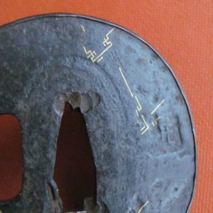 T467. Iron Tsuba with Gold Inlay and Shakudo Fukurin