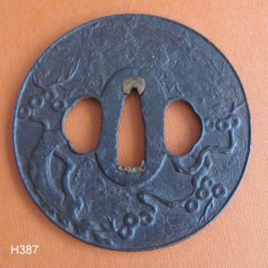 H387. Iron Plate Tsuba with Pine, Holbrook Collection