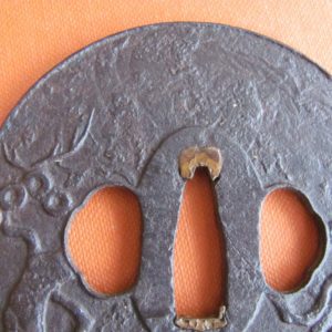 H387. Iron Plate Tsuba with Pine, Holbrook Collection