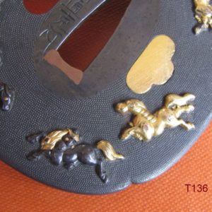 T136. Shakudo nanako tsuba with horses