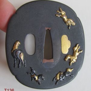 T136. Shakudo nanako tsuba with horses