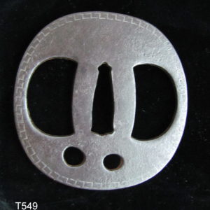 T549. Higo Tsuba, Iron with Brass Inlay