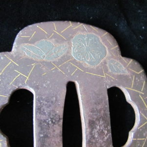 Q758. Iron Tsuba with Brass and Silver Inlay